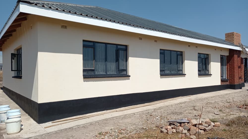 A completed Champs family home with cream walls and dark aluminium windows